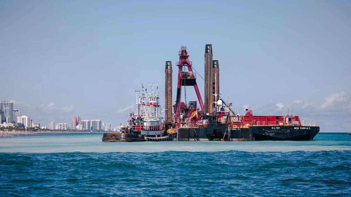 The dredging equipment in operation being used in the sand bypass project off the beach north of Port Everglades The dredging equipment in operation being used in the sand bypass project off the beach north of Port Everglades