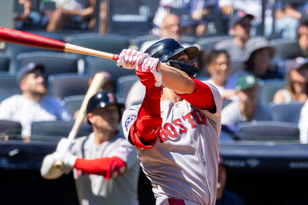Boston Red Sox player Roman Anthony hitting an RBI sac fly.