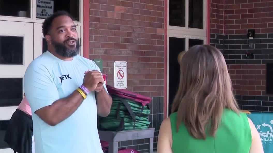 Former football player James Coleman gives away hundreds of backpacks to Orlando students