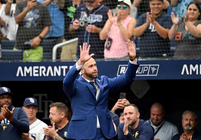 Former Tampa Bay Rays player Evan Longoria is introduced during his Rays Hall of Fame ceremony before a baseball game between the Rays and the Seattle Mariners, Saturday, July 11, 2026, in St. Petersburg, Fla. (AP Photo/Jason Behnken) Former Tampa Bay Rays player Evan Longoria is introduced during his Rays Hall of Fame ceremony before a baseball game between the Rays and the Seattle Mariners, Saturday, July 11, 2026, in St. Petersburg, Fla. (AP Photo/Jason Behnken)