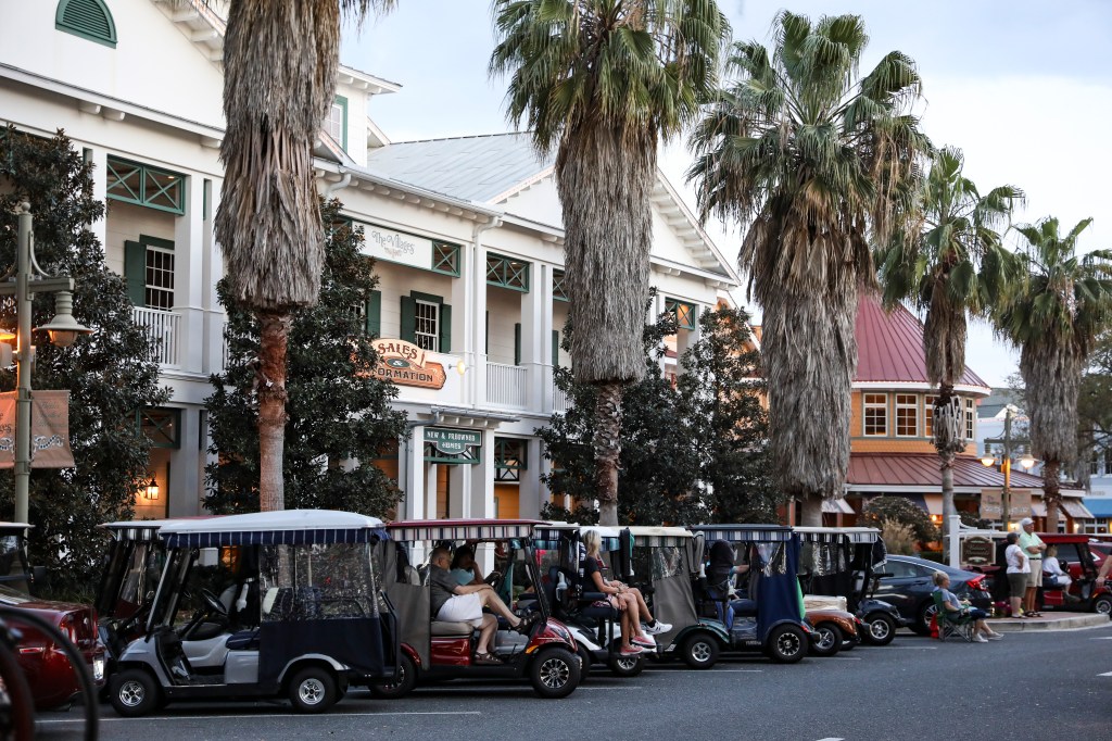 Golf carts lined up in Lake Sumter Landing Market Square in The Villages, Florida.