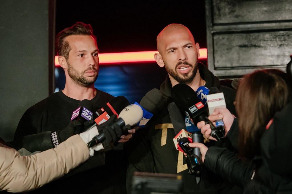 Andrew Tate and Tristan Tate speaking to reporters.