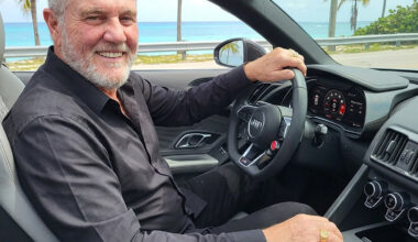 Glen Rimondi sits in an Audi R8 Spyder