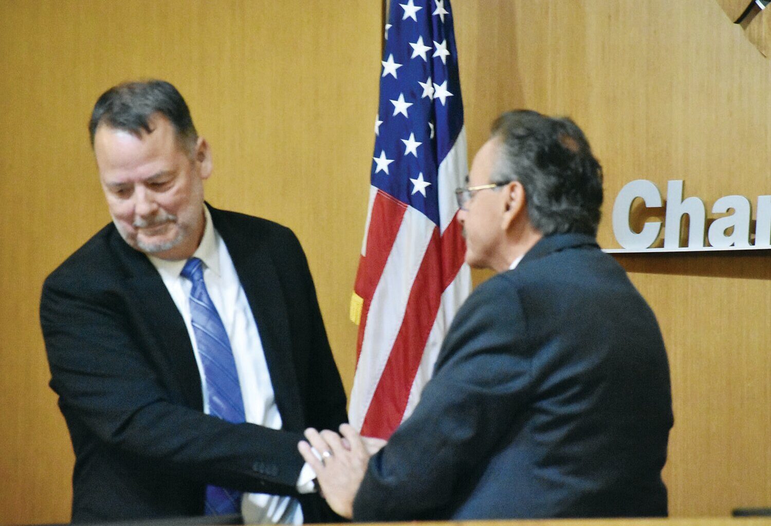 Jeff Weninger, left, and Matt Orlando shake hands after an April debate. Weninger conceded the July 21 mayoral election and Orlando claimed victory on July 22 as Orlando maintained a 17-point lead as ballots were counted. &nbsp;