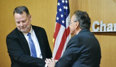 Jeff Weninger, left, and Matt Orlando shake hands after an April debate. Weninger conceded the July 21 mayoral election and Orlando claimed victory on July 22 as Orlando maintained a 17-point lead as ballots were counted. &nbsp;