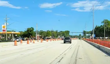 A view of the road with a car traveling at Butler Boulevard and Philips Highway.