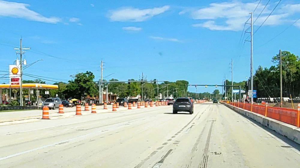 A view of the road with a car traveling at Butler Boulevard and Philips Highway.
