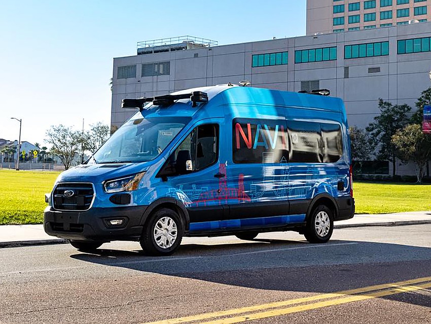 A van from the Jacksonville Transportation Authority's Neighborhood Autonomous Vehicle Innovation system heads east down Bay Street in Downtown. NAVI cost $65 million to start, part of JTA's broader capital investment plans even as the authority carries $15.06 million in delinquent bills. A van from the Jacksonville Transportation Authority's Neighborhood Autonomous Vehicle Innovation system heads east down Bay Street in Downtown. NAVI cost $65 million to start, part of JTA's broader capital investment plans even as the authority carries $15.06 million in delinquent bills.
