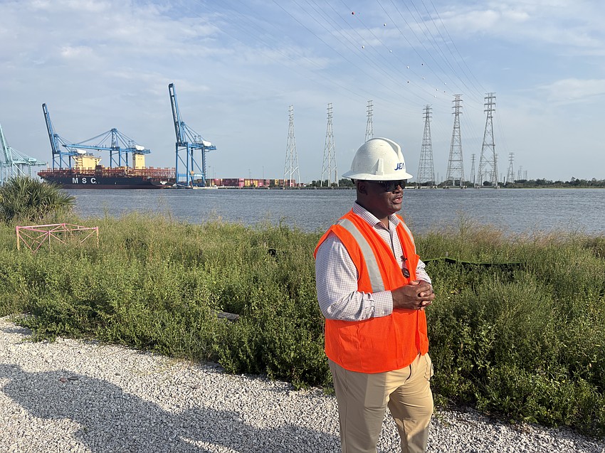 Darrell Hamilton, JEA’s manager of transmission and substation projects, speaks to media on the first day of helicopter work for the Fulton Cut line raising project near JaxPort’s Blount Island Marine Terminal.