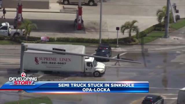 Crews remove semi-truck that became stuck in Opa-locka sinkhole caused by water main break; driver OK - WSVN 7News | Miami News, Weather, Sports