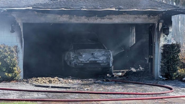 Car fire damages a home in Orange County