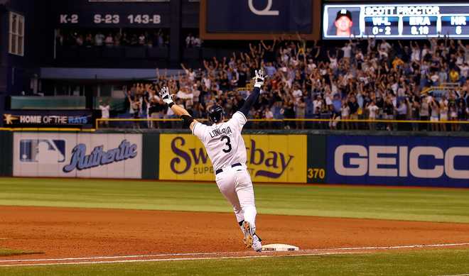 New York Yankees v Tampa Bay Rays ST. PETERSBURG, FL - SEPTEMBER 28: Evan Longoria #3 of the Tampa Bay Rays rounds the bases after his game-winning walk off home run in the twelfth inning against the New York Yankees during the game at Tropicana Field on September 28, 2011 in St. Petersburg, Florida. (Photo by J. Meric/Getty Images)