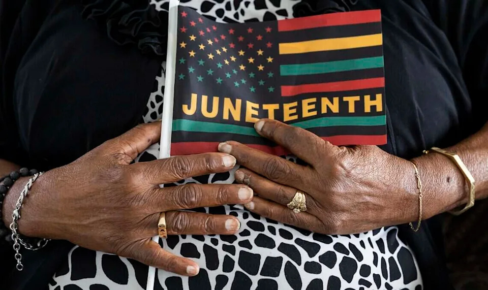 Barbara Williamson, 85, holds a Juneteenth flag at her home on Thursday, June 18, 2026, in Fort Lauderdale, Fla. Williamson participated in sit-ins and fought for passage of the Voting Rights Act of 1965.