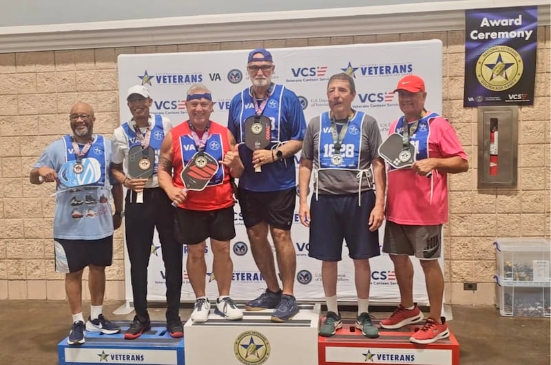 On the far right, Elder Timothy Fagan, a Latter-day Saint and military relations service missionary, receives a silver medal after competing in pickleball during the 2026 National Veterans Golden Age Games held in Tampa, Florida, from June 27 to July 2.
