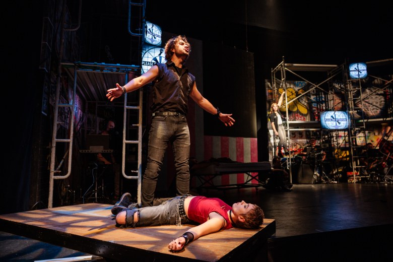 Musical improv performers live on stage creating Christmas songs from audience input.