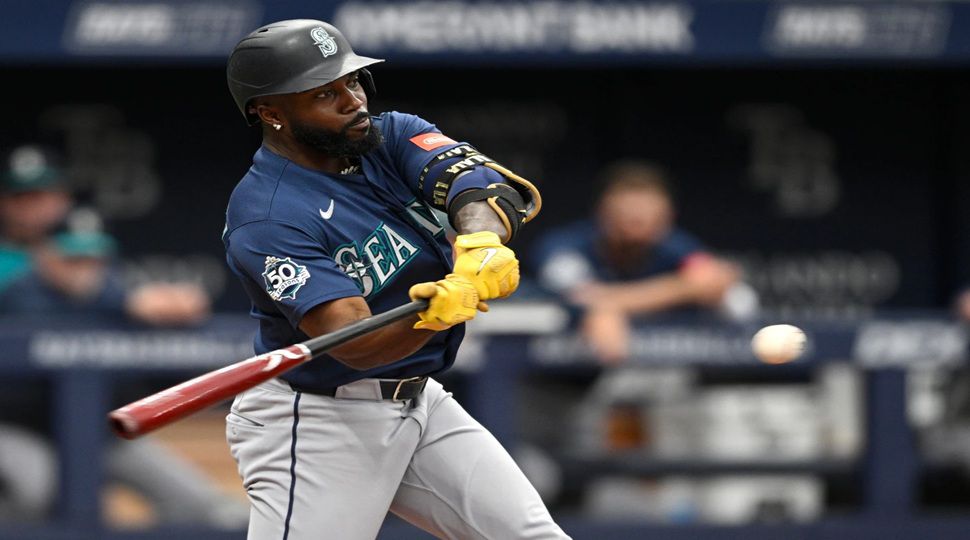 Seattle Mariners' Randy Arozarena hits a three-run home run during the fourth inning of a baseball game against the Tampa Bay Rays, Sunday, July 12, 2026, in St. Petersburg, Fla. (AP Photo/Phelan M. Ebenhack)