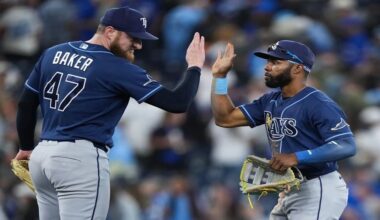 Tampa Bay Rays outfielder Cedric Mullins, right, celebrates with Bryan Baker (47) after defeating the Toronto Blue Jays in a baseball game in Toronto on Wednesday, July 22, 2026. (Nathan Denette/The Canadian Press via AP)