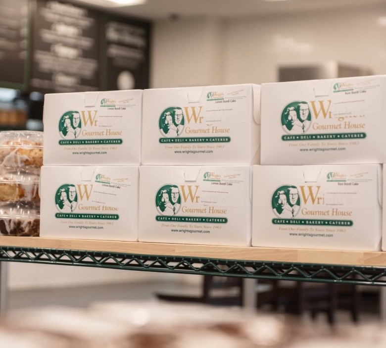 A stack of cake boxes from Tampa's Wright's Gourmet House.