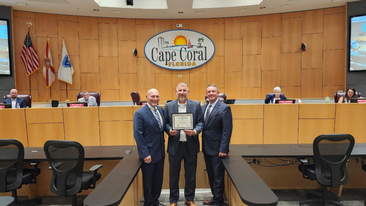 Ed Lavallee, Senior Advisor of FCCMA (left), presented an award to  City Manager Michael Ilczyszyn (center) and Mayor John Gunter (right) for the City of  Cape Coral's 40 years of service under the council-manager form of government.