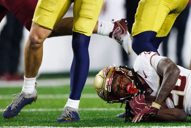 Florida State running back Samuel Singleton Jr. (28) is brought down during a NCAA college football game against Notre Dame at Notre Dame Stadium on Saturday, Nov. 9, 2024, in South Bend.