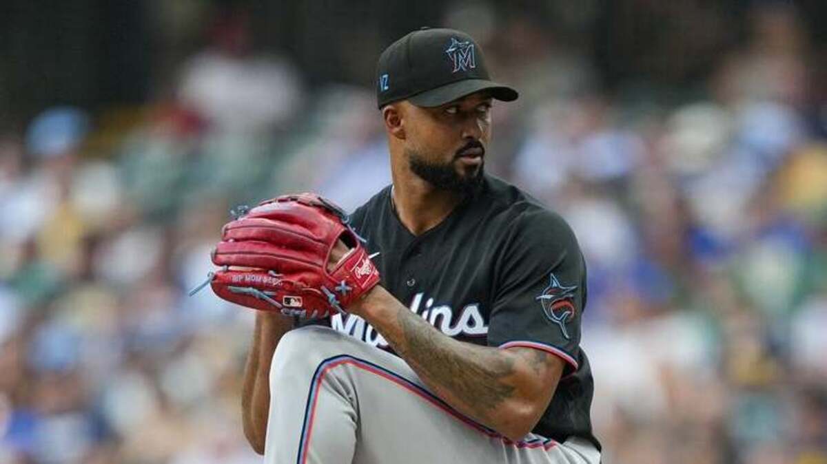 Brewers edge Marlins 2-1 in extra innings opener