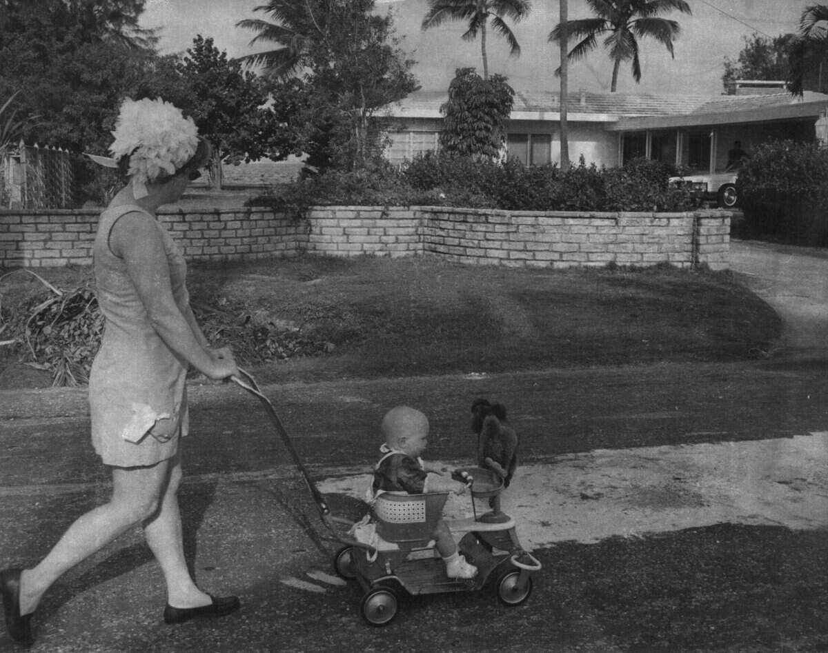 A Key Biscayne residents walks past the Nixon residence.