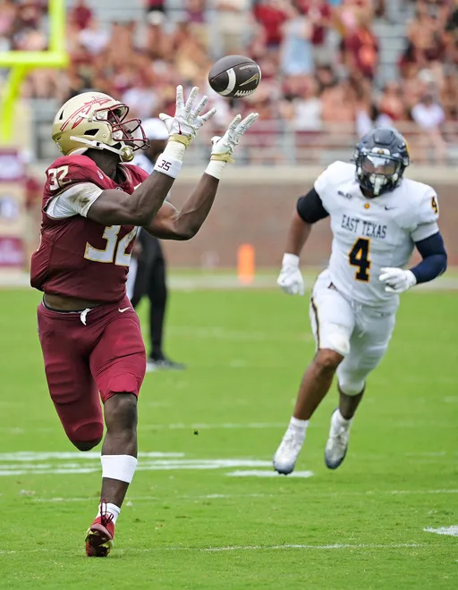 Florida State Seminoles running back Ousmane Kromah catches a touchdown pass.