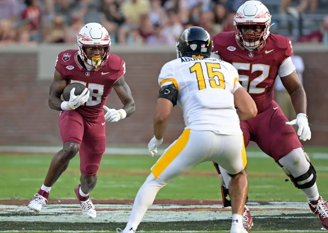 Sep 20, 2025; Tallahassee, Florida, USA; Florida State Seminoles running back Samuel Singleton Jr. (28) runs the ball during the second half against the Kent State Golden Flashes at Doak S. Campbell Stadium. Mandatory Credit: Melina Myers-Imagn Images