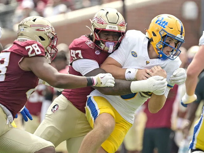 Oct 11, 2025; Tallahassee, Florida, USA; Florida State Seminoles defensive lineman Mandrell Desir (93) sacks Pittsburgh Panthers quarterback Mason Heintschel (6) during the first half at Doak S. Campbell Stadium. Mandatory Credit: Melina Myers-Imagn Images
