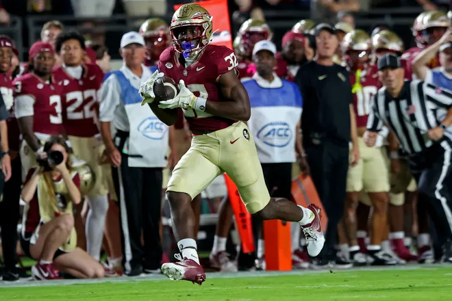 TALLAHASSEE, FLORIDA - OCTOBER 4: Ousmane Kromah #32 of the Florida State Seminoles runs after making a reception in the first half of the game against the Miami Hurricanes at Doak S. Campbell Stadium on October 4, 2025 in Tallahassee, Florida. (Photo by Jason Clark/Getty Images)