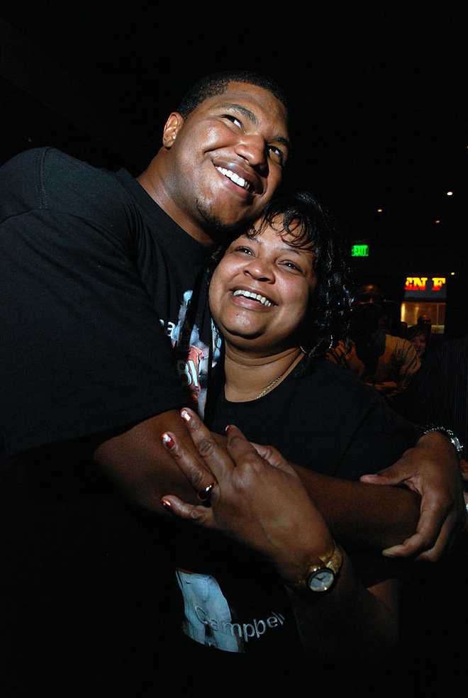 (HC) Calais Campbell- Former Denver South star player Calais Campbell of University of Miami, left, celebrates his draft pick from Arizona Cardinals with his mother Nateal at ESPN Sports Zone in Denver on Saturday. The Denver Post / Hyoung Chang  (Photo By Hyoung Chang/The Denver Post via Getty Images)