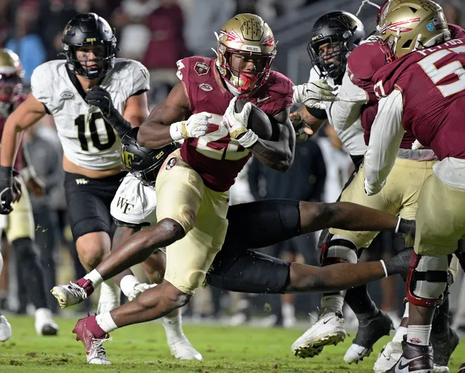 Nov 1, 2025; Tallahassee, Florida, USA; Florida State Seminoles running back Samuel Singleton Jr. (8) runs the ball during the second half against the Wake Forest Demon Deacons at Doak S. Campbell Stadium. Mandatory Credit: Melina Myers-Imagn Images
