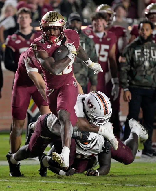 Nov 15, 2025; Tallahassee, Florida, USA; Florida State Seminoles running back Samuel Singleton (28) runs the ball during the second half against the Virginia Tech Hokies at Doak S. Campbell Stadium. Mandatory Credit: Melina Myers-Imagn Images