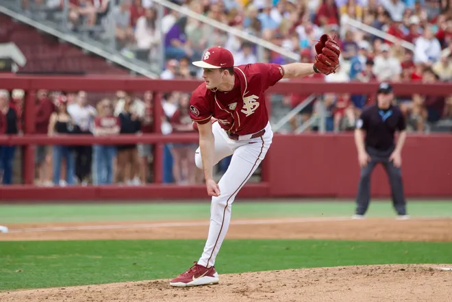 Bryson Moore throws a pitch as Florida State baseball beat James Madison 16-5 on Saturday, Feb. 14 at Dick Howser Stadium