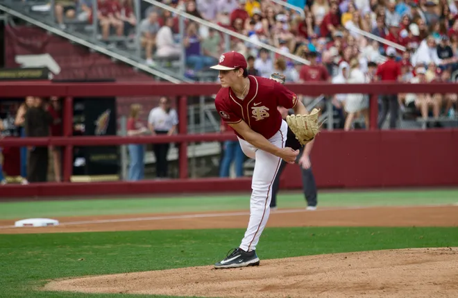 Bryson Moore throws a pitch as Florida State baseball beat James Madison 16-5 on Saturday, Feb. 14 at Dick Howser Stadium