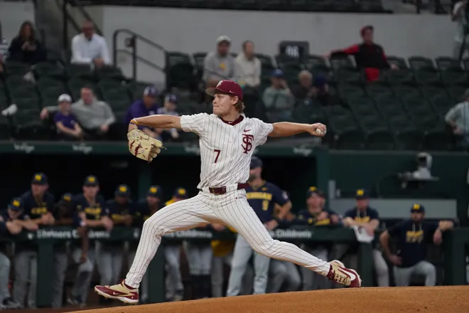 Feb 20, 2026; Arlington, TX, USA; Wes Mendes pitches for the Florida State Seminoles against the Michigan Wolverines during the Amegy Bank College Baseball Series at Globe Life Field. Mandatory Credit: Raymond Carlin III-Imagn Images