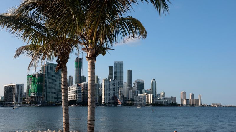 MIAMI, FLORIDA - APRIL 29: A person sits in a beach chair with the Miami skyline in view on the day Florida’s Republican-controlled legislature passed a new congressional map on April 29, 2026 in Miami, Florida. The new map creates four more GOP-leaning seats in Florida, including those held by Democrats Jared Moskowitz and Debbie Wasserman Schultz, both from South Florida. (Photo by Joe Raedle/Getty Images)