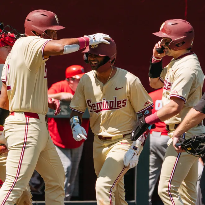 FSU baseball's Kelvyn Paulino Jr celebrates a home run with Myles Bailey and Brayden Dowd on Sunday, March 22, 2026