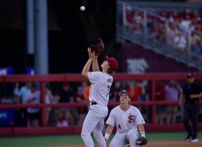Wes Mendes (left) catches a bunt as Cal Fisher (right) looks on as Florida State baseball hosted Miami at Dick Howser Stadium on Thursday, May 14, 2026 in the first of three games.