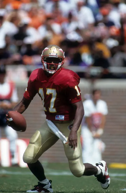 TALLAHASSEE, FL - SEPTEMBER 11: Quarterback Charlie Ward #17 of the Florida State Seminoles looks to run the ball during an NCAA game against the Clemson Tigers on September 11, 1993 at Doak Campbell Stadium in Tallahassee, Flroida. The Seminoles defeated the Tigers 57-0. (Photo by Scott Halleran/Getty Images)