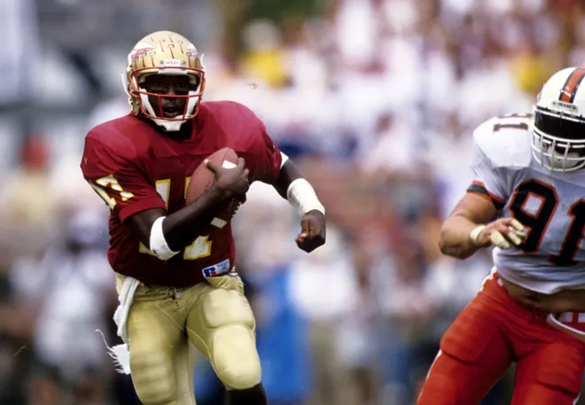 Oct 9, 1993; Tallahassee, FL, USA: FILE PHOTO; Florida State Seminoles quarterback Charlie Ward (17) runs with the ball against Miami at Doak Campbell Stadium. FSU defeated Miami 28-10 Mandatory Credit: USA TODAY Sports