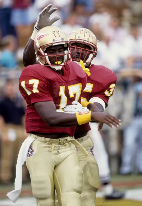 Oct 10, 1992; Tallahassee, FL, USA: FILE PHOTO; Florida State Seminoles quarterback Charlie Ward (17) celebrates after scoring against North Carolina at Doak Campbell Stadium. FSU defeated North Carolina 36-13. Mandatory Credit: USA TODAY Sports