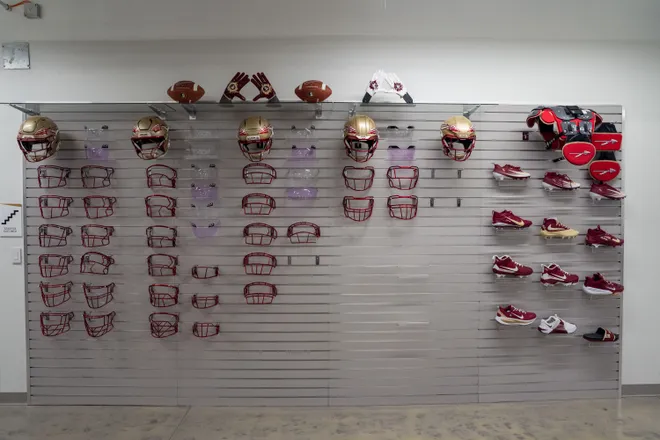 Available equipment options are displayed for players to choose from when getting their uniforms inside the Florida State University Dunlap Football Center.