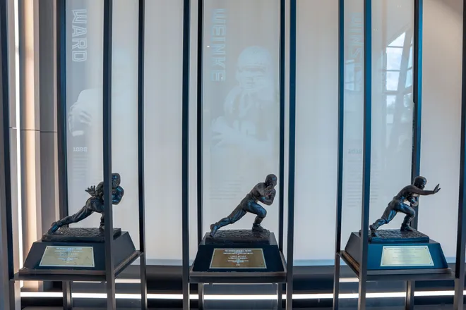 Replica Heisman Trophies are displayed in the lobby of the Florida State University Dunlap Football Center.