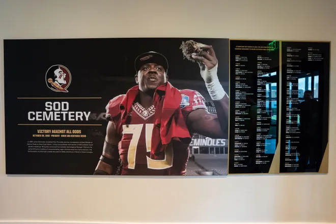 The history of the Sod Cemetery is displayed on a wall inside the Florida State University Dunlap Football Center.