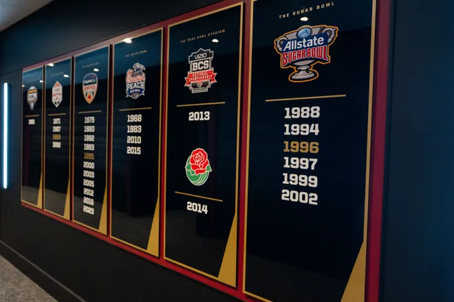 Florida State’s bowl game wins are displayed on a wall inside the Florida State University Dunlap Football Center.