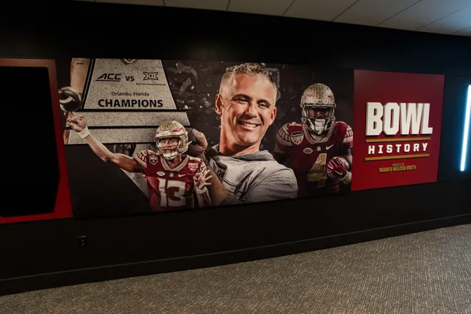 The history of bowl games for Florida State is displayed on a wall inside the Florida State University Dunlap Football Center.