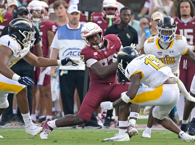Sep 20, 2025; Tallahassee, Florida, USA; Florida State Seminoles running back Ousmane Kromah (32) runs the ball during the second half against Kent State Golden Flashes at Doak S. Campbell Stadium. Mandatory Credit: Melina Myers-Imagn Images