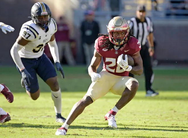 Nov 23, 2024; Tallahassee, Florida, USA; Florida State Seminoles running back Samuel Singleton Jr. (28) runs the ball against the Charleston Southern Buccaneers during the second half at Doak S. Campbell Stadium. Mandatory Credit: Melina Myers-Imagn Images