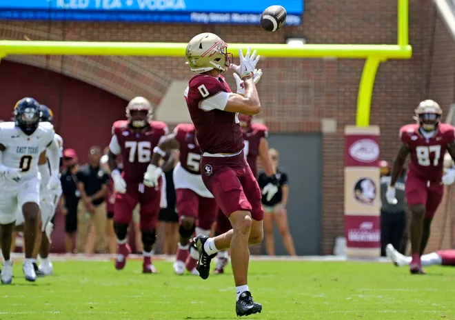 Sep 6, 2025; Tallahassee, Florida, USA; Florida State Seminoles wide receiver Duce Robinson (0) catches a touchdown during the first half against the East Texas A & M at Doak S. Campbell Stadium. Mandatory Credit: Melina Myers-Imagn Images